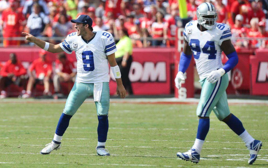 Dallas Cowboys quarterback Tony Romo (9) exhorts the defense as defensive end DeMarcus Ware (94) takes the field in the fourth quarter during the Dallas Cowboys vs. the Kansas City Chiefs NFL football game at Arrowhead Stadium in Kansas City on Sunday, September 15, 2013.  (Louis DeLuca/Dallas Morning News)