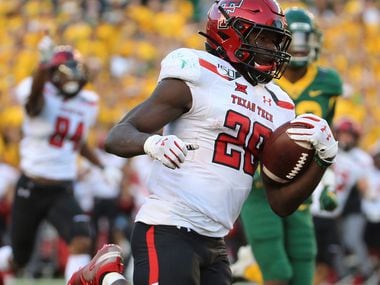 Texas Tech running back SaRodorick Thompson (28) scores a touchdown against Baylor during the second half of a NCAA college football game in Waco, Tex., Saturday, Oct. 12, 2019.(AP Photo/Jerry Larson)