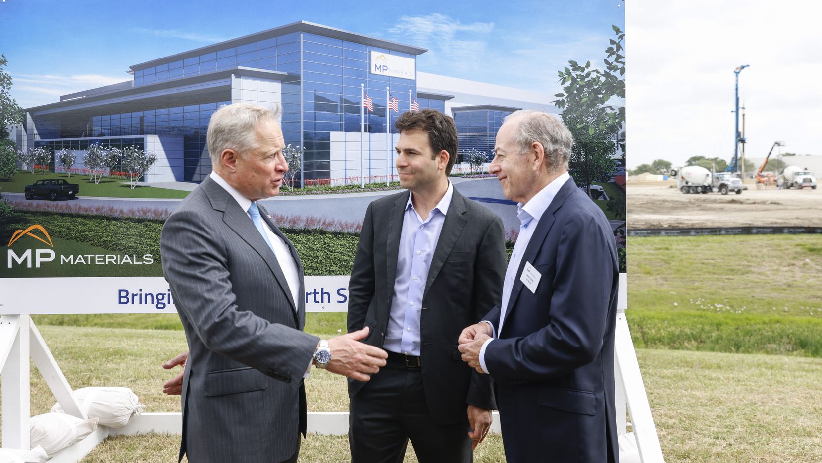 Ross Perot Jr. (left) speaks with MP Materials executives James (center) and Steven Litinsky...