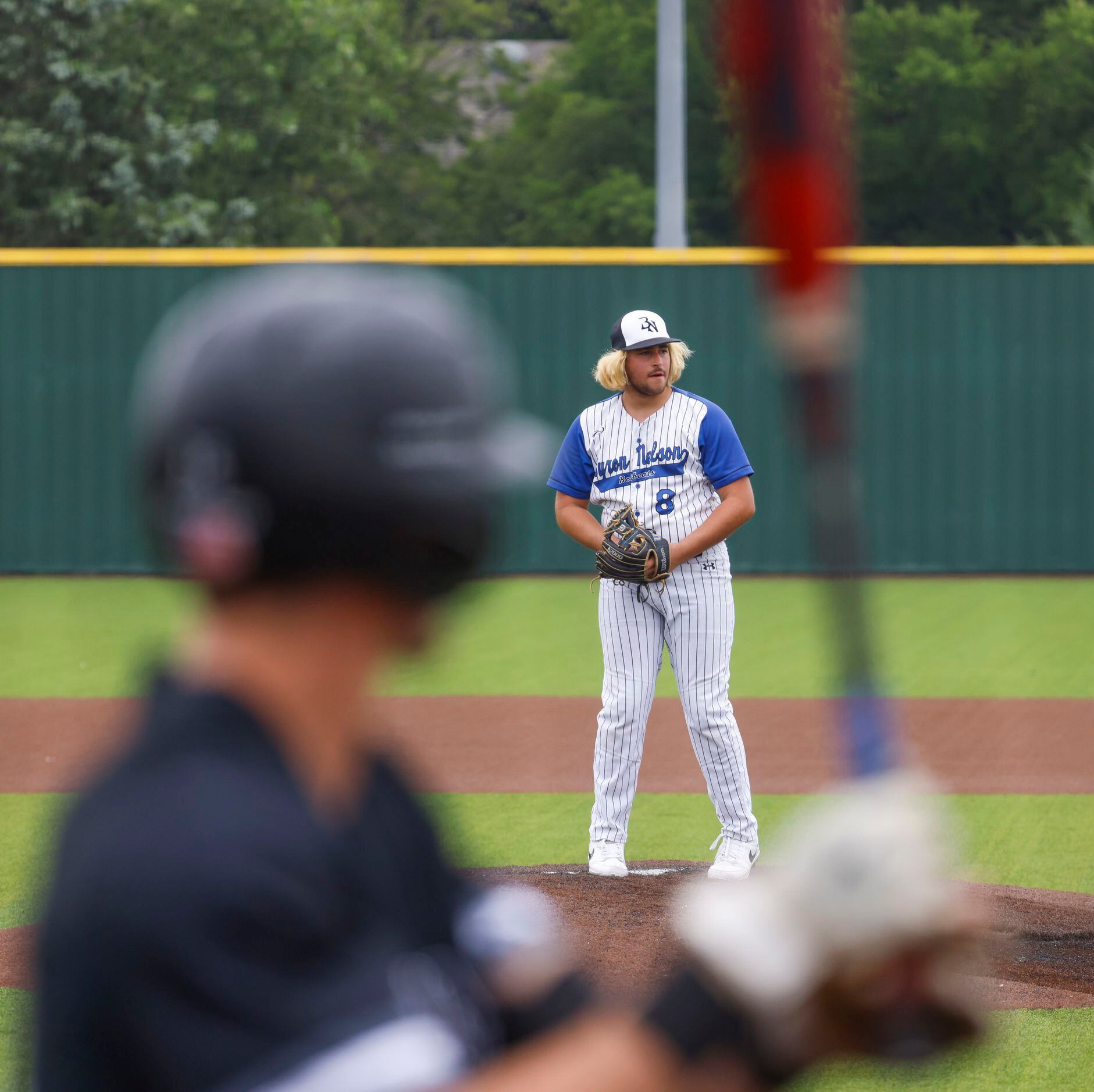 Byron Nelson High School’s Aeden Barron gets set to throw a pitch during the fifth inning of...