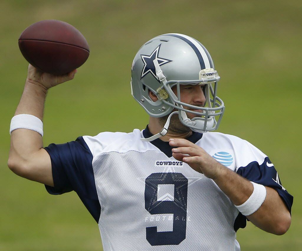Dallas Cowboys quarterback Tony Romo (9) throws the ball during organized team activities at...