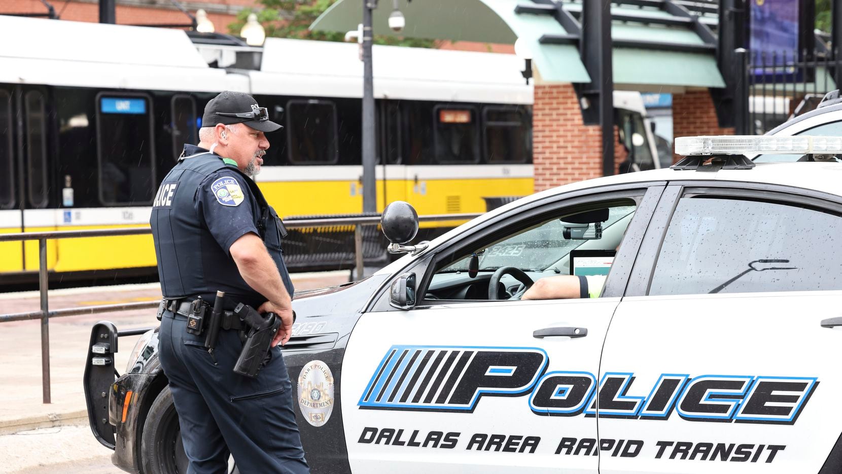 Police in the parking lot near the West End DART light rail station on Thursday, May 5,...