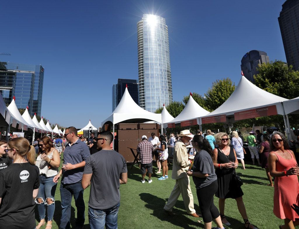 Guests enjoy food and drinks during the Park & Palate food festival at Klyde Warren Park in...