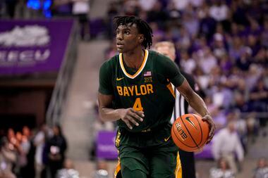 Baylor guard Ja'Kobe Walter (4) handles the ball during the second half of an NCAA college...