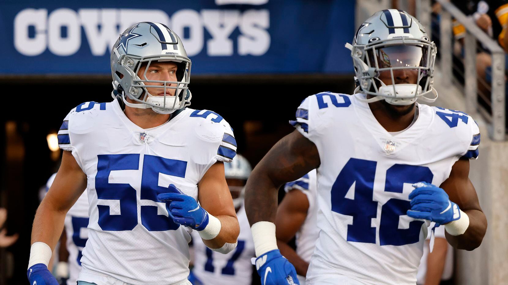 Dallas Cowboys linebackers Leighton Vander Esch (55) and Keanu Neal (42) take the field to face the Pittsburgh Steelers in their first preseason game at Tom Benson Hall of Fame Stadium in Canton, Ohio, Thursday, August 5, 2021.