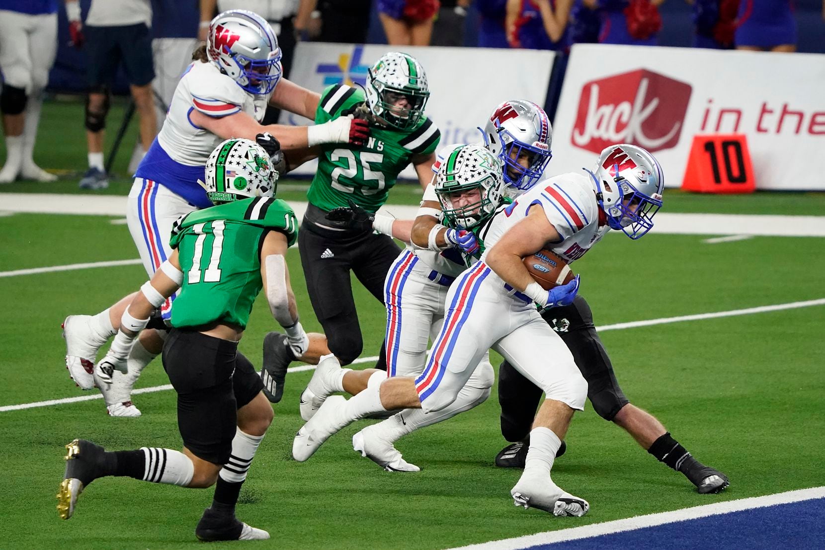 Austin Westlake running back Grey Nakfoor (22) scores on a touchdown run past Southlake Carroll defensive back Josh Spaeth (11) during the fourth quarter of the Class 6A Division I state football championship game at AT&T Stadium on Saturday, Jan. 16, 2021, in Arlington, Texas. Westlake won the game 52-34.