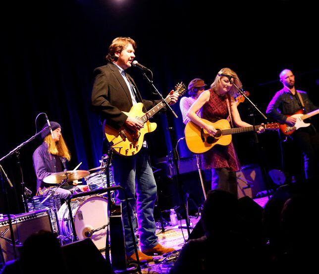 Bruce Robison (at the microphone) and his wife Kelly Willis perform at The Kessler Theater. 