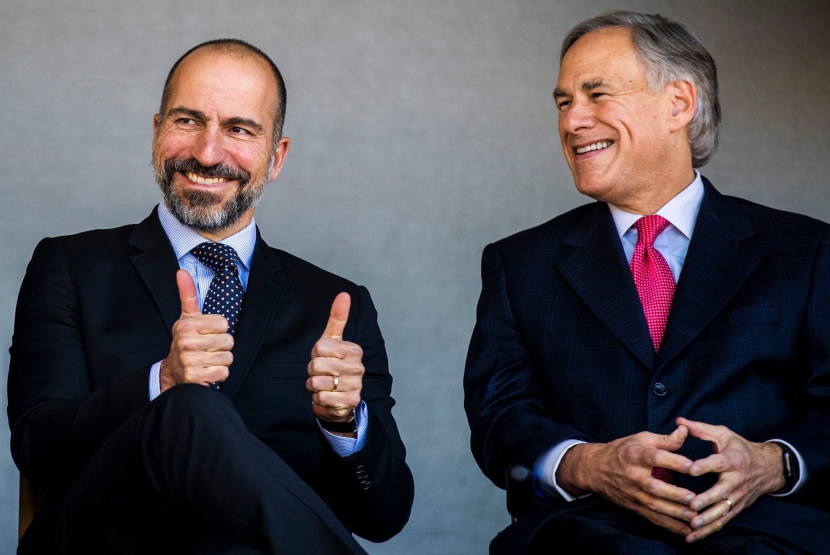 Uber CEO Dara Khosrowshahi gives a thumbs up next to Gov. Greg Abbott at a ground breaking ceremony for a new Uber Deep Ellum office on Friday, November 1, 2019 in Dallas. (Ashley Landis/The Dallas Morning News)