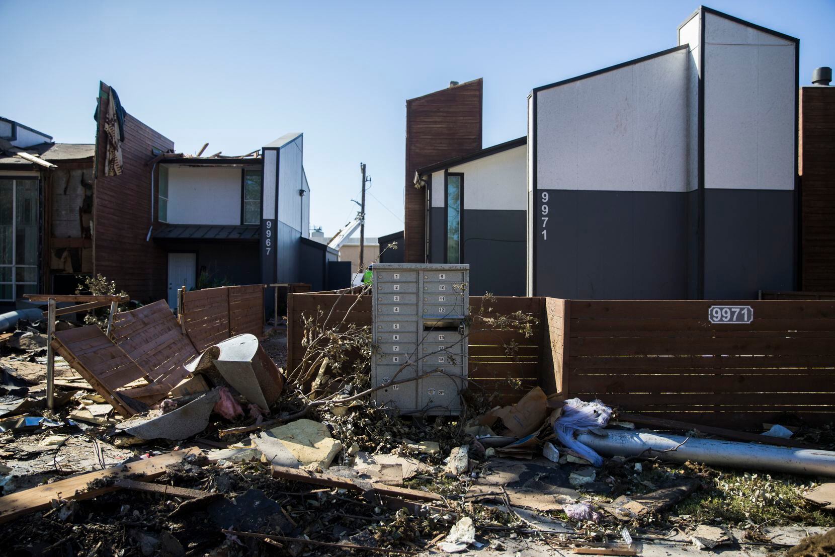 Debris stacked up outside the tornado-damaged Southwind Apartments on Wednesday, October 23, 2019 at on Brockbank Drive in Dallas.