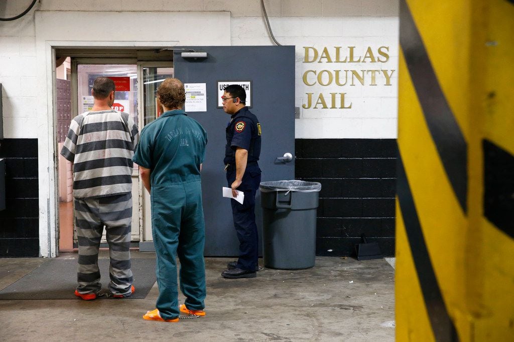 An inmate is booked into the Dallas County Jail in this file photo.