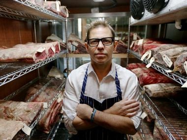 Chef John Tesar stands near dry-aged prime cuts in the meat locker at the Knife restaurant in Dallas Wednesday July 9, 2014. (Andy Jacobsohn/The Dallas Morning News) 07182014xNEWS 07182014xBRIEFING 08132014xBRIEFING 07312015xBRIEFING 09232015xPUB 09192015xPUB
