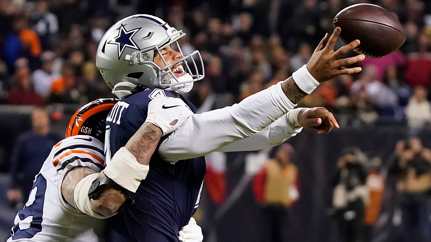 Dallas Cowboys quarterback Dak Prescott (4) tries to get off a pass as he is hit by Chicago Bears outside linebacker Aaron Lynch (99), resulting in a ruling of intentional grounding, during the second half of an NFL football game at Soldier Field on Thursday, Dec. 5, 2019, in Chicago. (Smiley N. Pool/The Dallas Morning News)