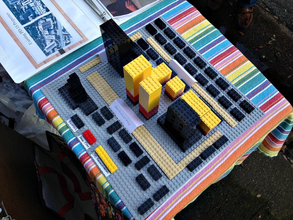 This Lego model of PD15 was on display at Monday's block party/protest. The red is as high as some residents say they're willing to go.