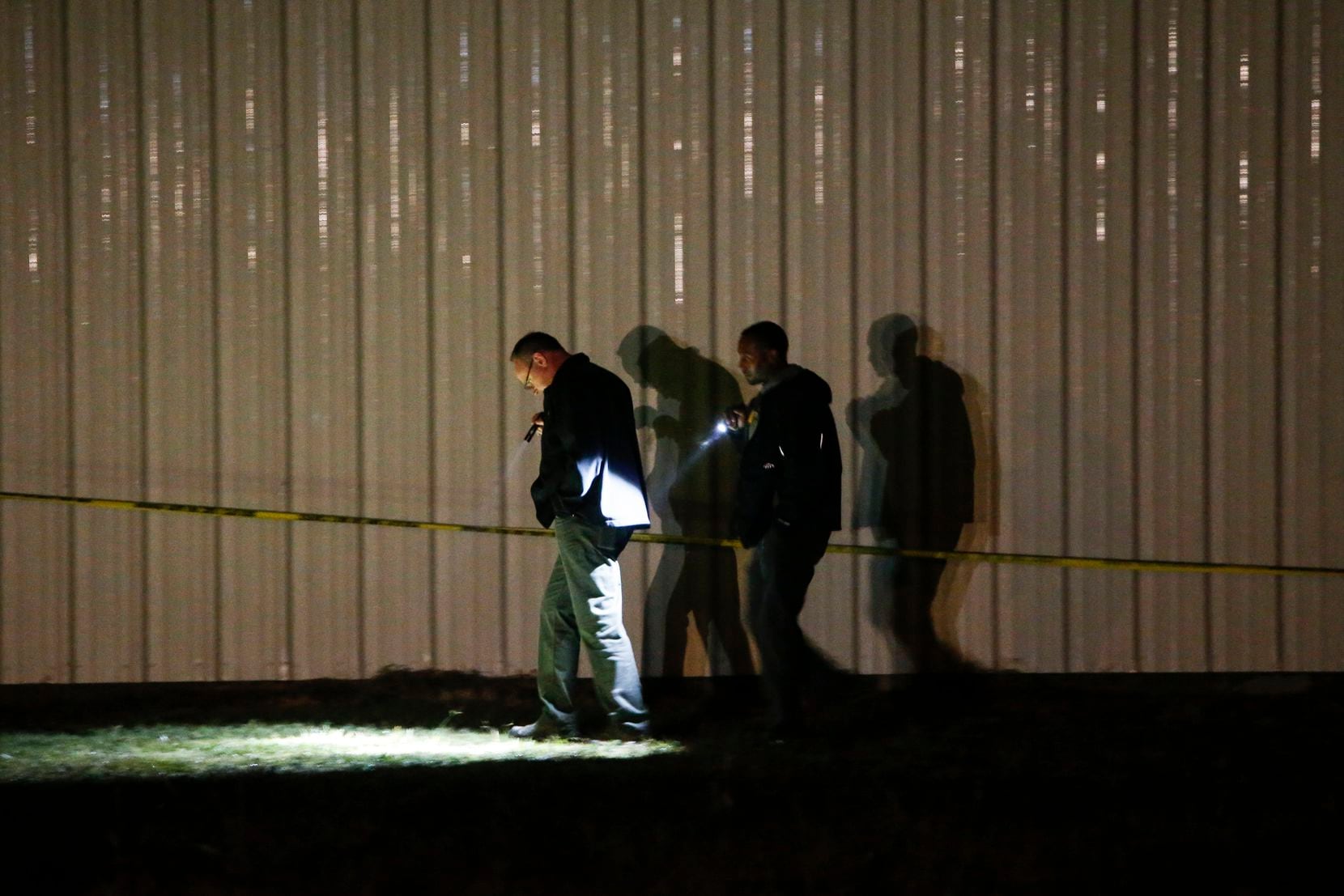 Officials work a crime scene after a shooting at Party Venue on Highway 380 in Greenville, Texas.