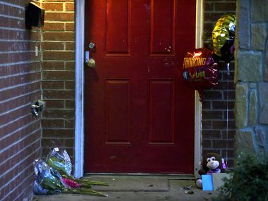 Flowers, balloons and cards have been placed outside of a home where 1-year-old boy Rory Norman was killed and his uncle was shot inside a home early Sunday morning on Valentine Street in South Dallas, Jan. 5, 2020.