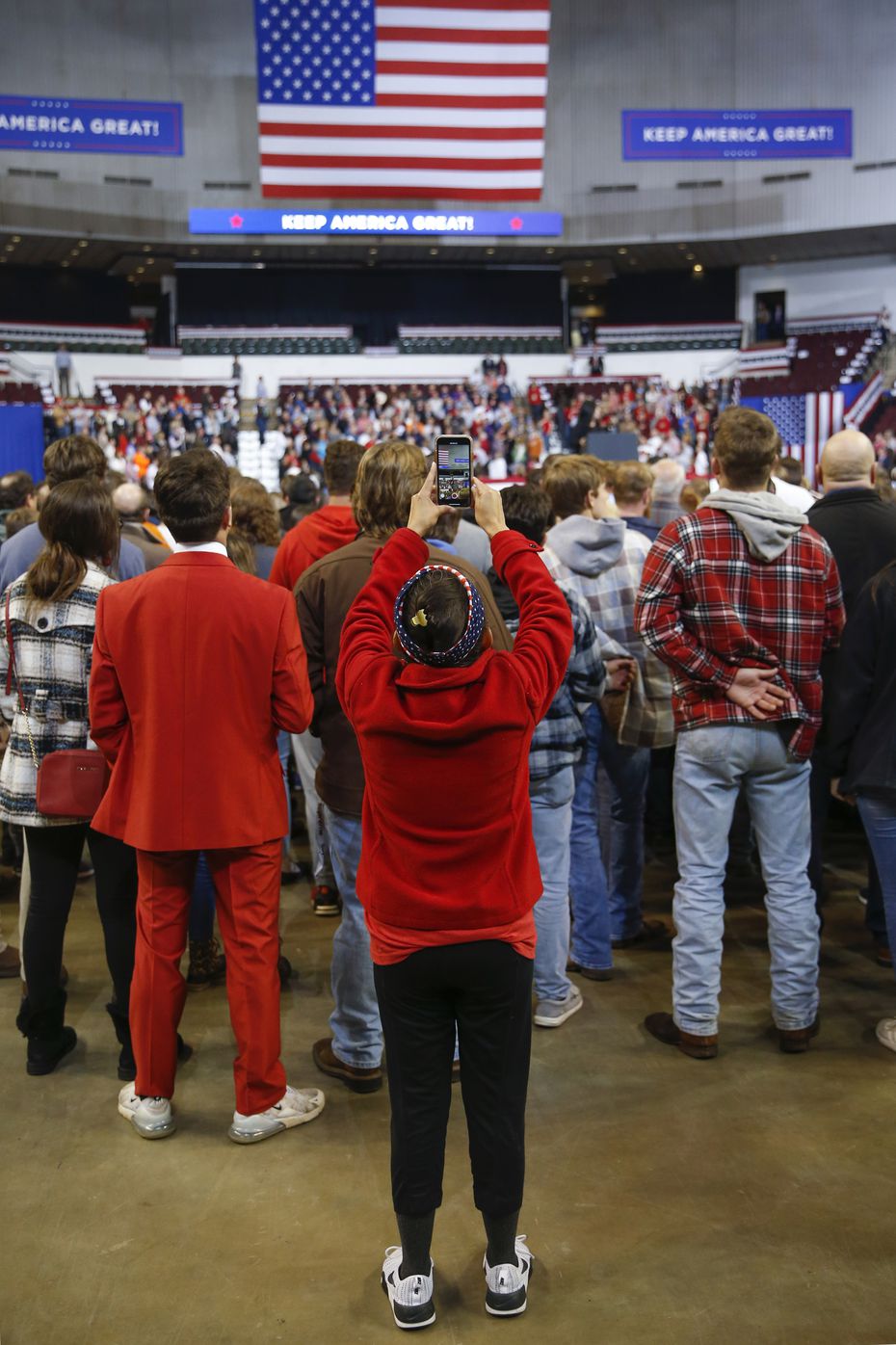 Martha Doss recorded a video of opening speakers at a rally to reelect President Donald Trump in Bossier City, La., on Nov. 14, 2019. Doss, a rising social media star in conservative circles, was sent by the National Republican Hispanic Assembly to create social media content.