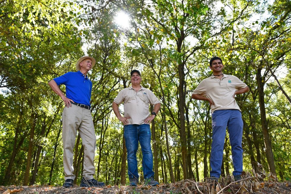 Environmentalist and Container Store co-founder Garrett Boone (from left), with Richard Buckley, executive director of Groundwork Dallas, and Aaryaman Singhal, chief operating officer of Groundwork Dallas, during a tour of the trails near the Elm Fork of the Trinity River.