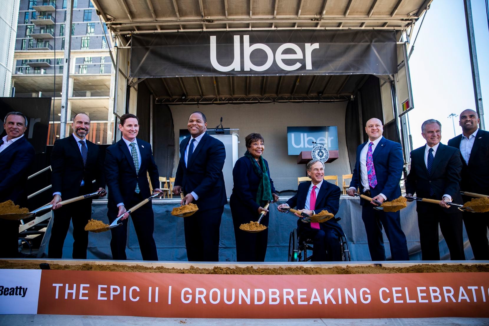 Uber CEO Dara Khosrowshahi (second from left), Dallas Mayor Eric Johnson (fourth from left), Governor Greg Abbott (fourth from right) and other city and state officials pose for a photo during a ground breaking ceremony for a new Uber Deep Ellum office on Friday, November 1, 2019 in Dallas. (Ashley Landis/The Dallas Morning News)