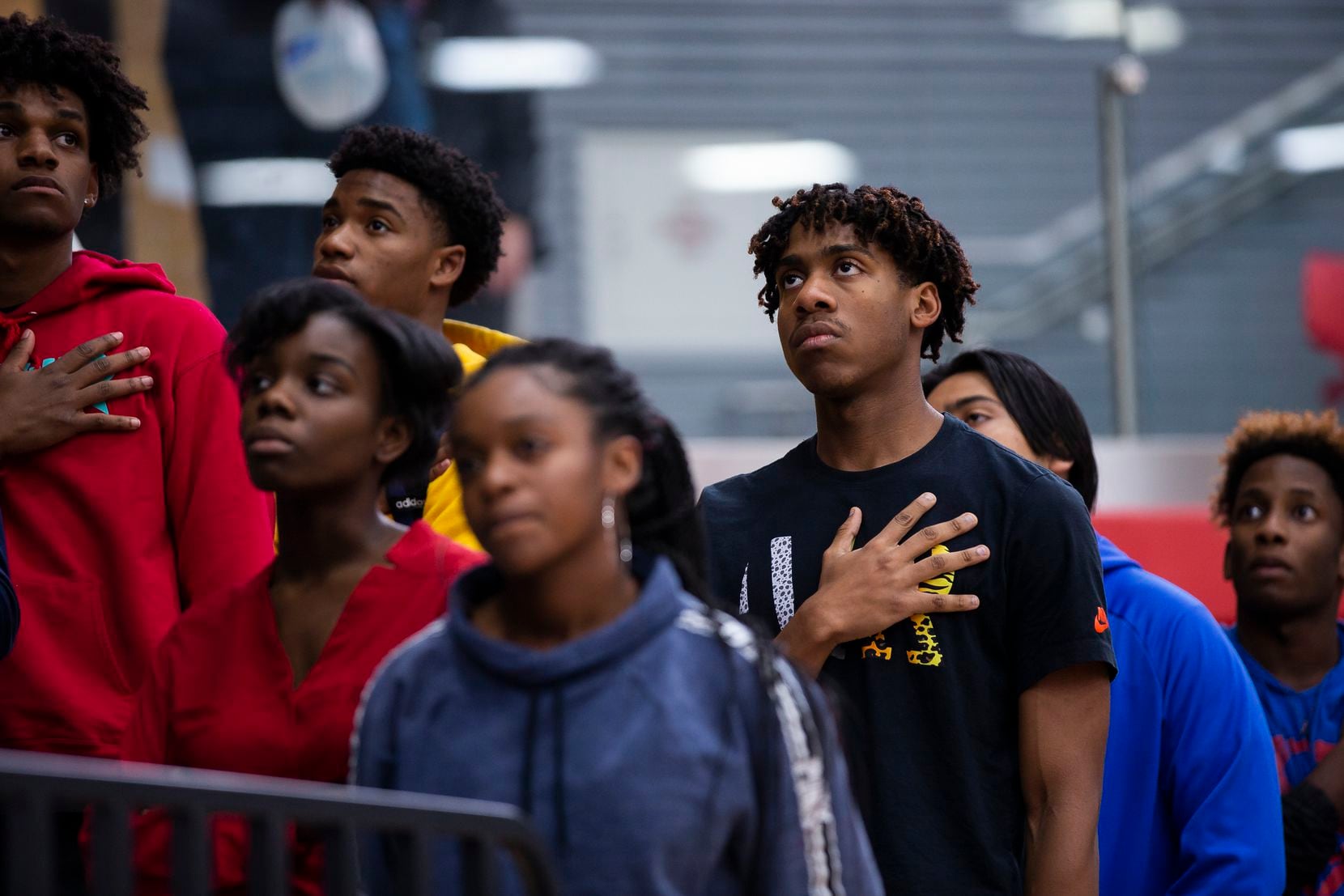 Allen High School junior Devon Chatman, 16, pauses for a moment of silence remembering Marquel Ellis Jr., 16, before a varsity basketball game on Nov. 18, 2019 in Allen. Ellis, a sophomore, was fatally shot at a Plano home late Saturday, according to police and school officials. (Juan Figueroa/ The Dallas Morning News)
