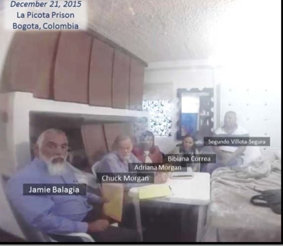Jamie Balagia, left, and Chuck Morgan, to his right, meet with alleged drug kingpin Segundo Segura in La Picota prison in Colombia in December 2015 to discuss a plot that federal prosecutors call an illegal shakedown. The image was taken from a secret videotape that Segura recorded of the meeting.