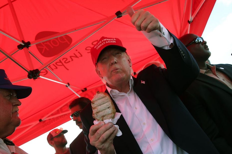 Future president Donald Trump eats pork chop on a stick while campaigning Aug. 15, 2015, at the Iowa State Fair in Des Moines. 