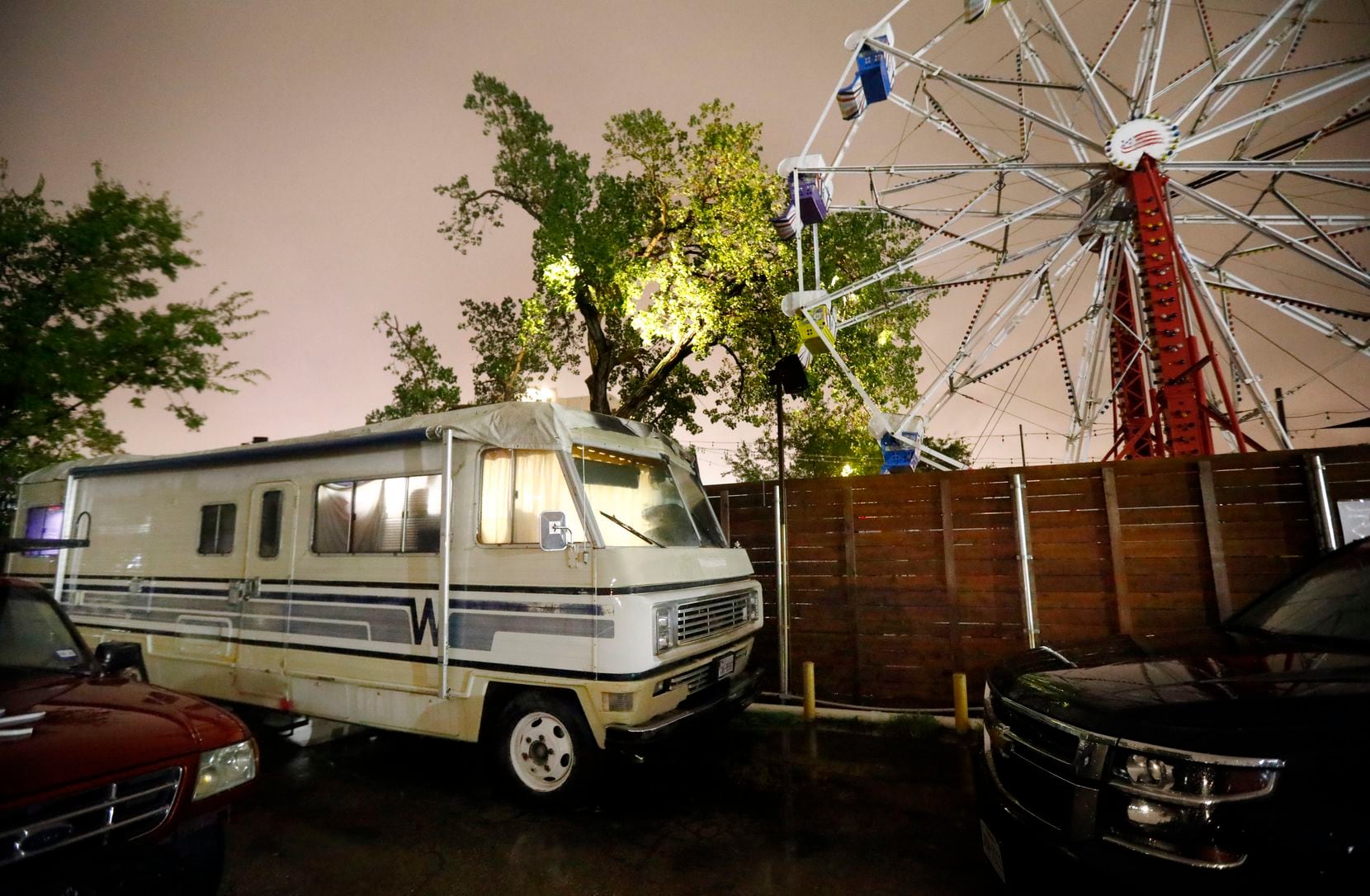 The ride at next-door Ferris Wheelers overlooks the Jade Spa, and the camper where police found a man who claimed to be the spa's maintenance man.