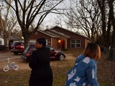 Ella Mae Beasley, 57, left, and her niece walked by the home where 1-year-old Rory Norman was shot and killed early Sunday morning on Valentine Street in South Dallas, Jan. 5, 2020.