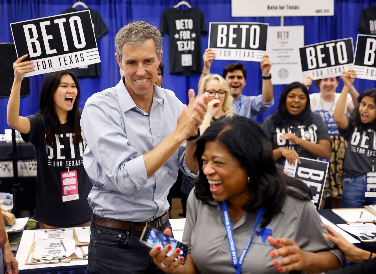 Democratic gubernatorial challenger Beto O'Rourke applauds his supporters as he took photos...