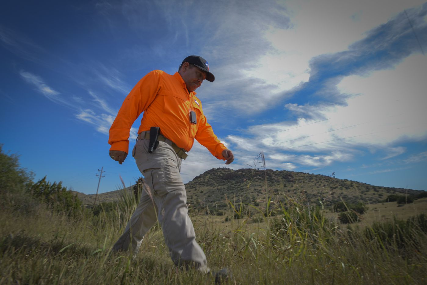 Kelley Janysek, of Texas Search and Rescue searches the rugged Brewster County terrain on...