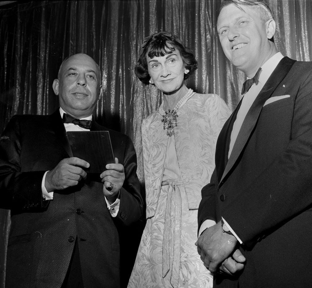 French fashion designer Coco Chanel poses with Stanley Marcus, left, president of...