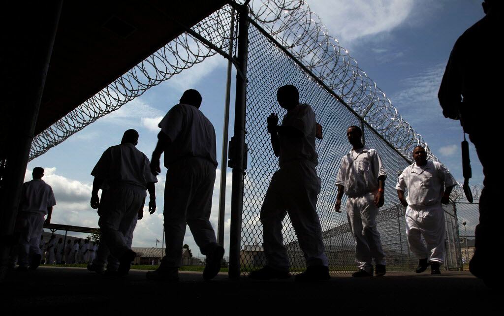 Inmates walk to the Chow Hall at TDCJ's Hightower Unit in Dayton, Texas, in July 2014....