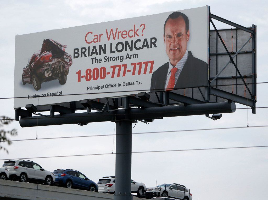 A billboard for attorney Brian Loncar along Interstate 30 near Commerce Street in Dallas on...