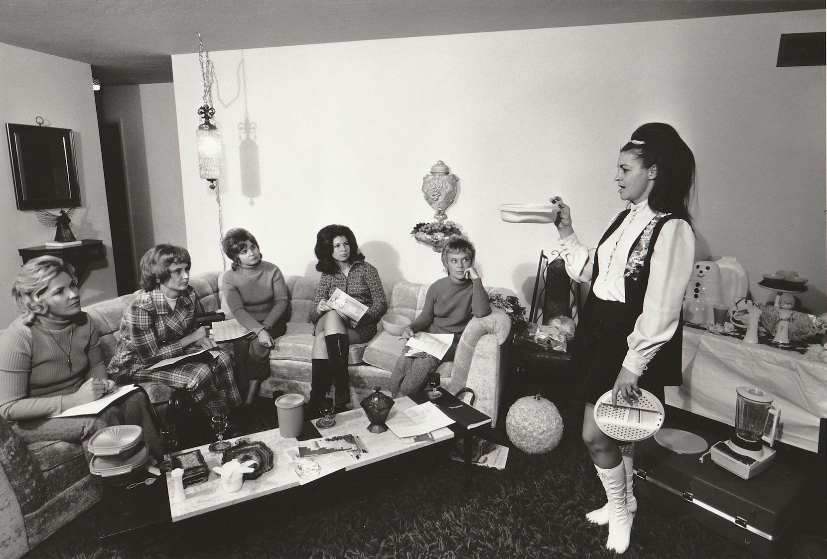 Bill Owens' "Tupperware Party" captures a moment in suburban Livermore, Calif., in 1968....
