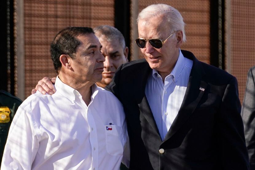 President Joe Biden talks with Rep. Henry Cuellar, D-Laredo, as they walk along the...