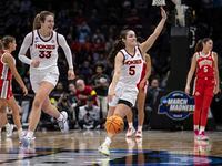 Virginia Tech guard Georgia Amoore (5) and center Elizabeth Kitley (33) celebrate in the...