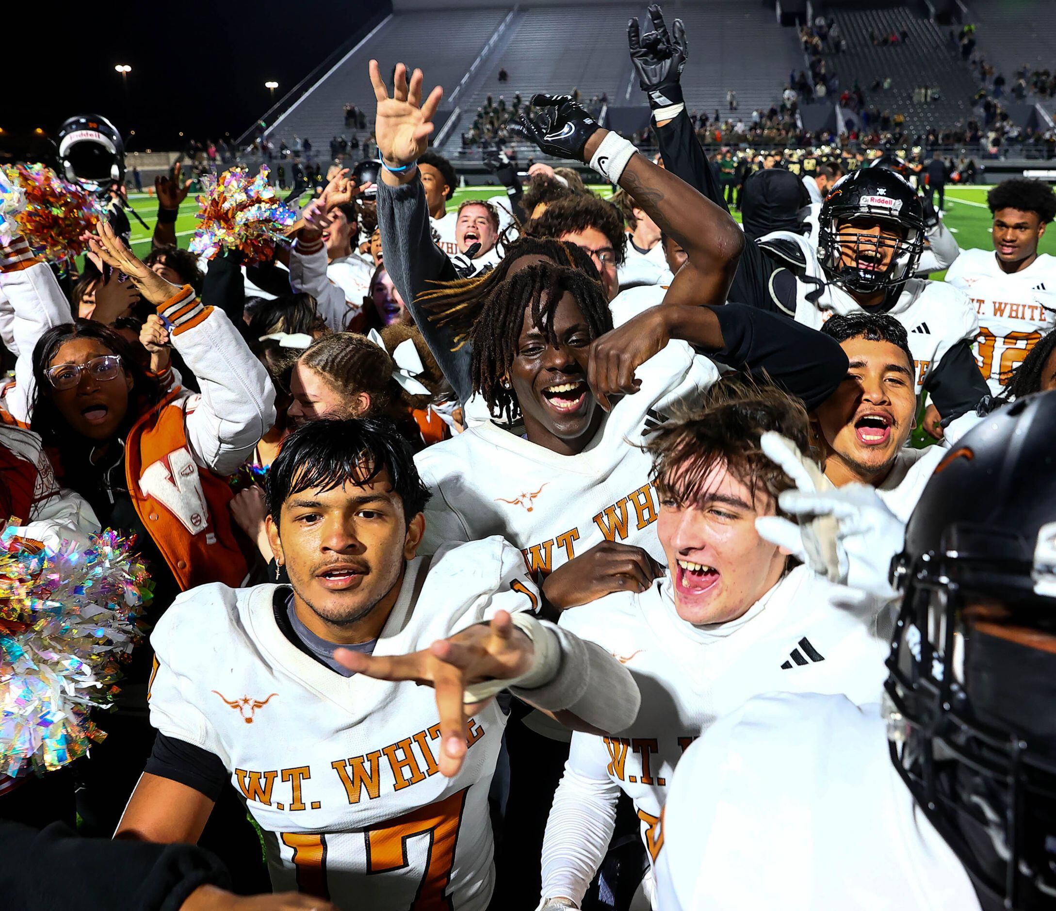 W.T. White Longhorns celebrate their victory over Birdville, 38-35 in overtime in a District...
