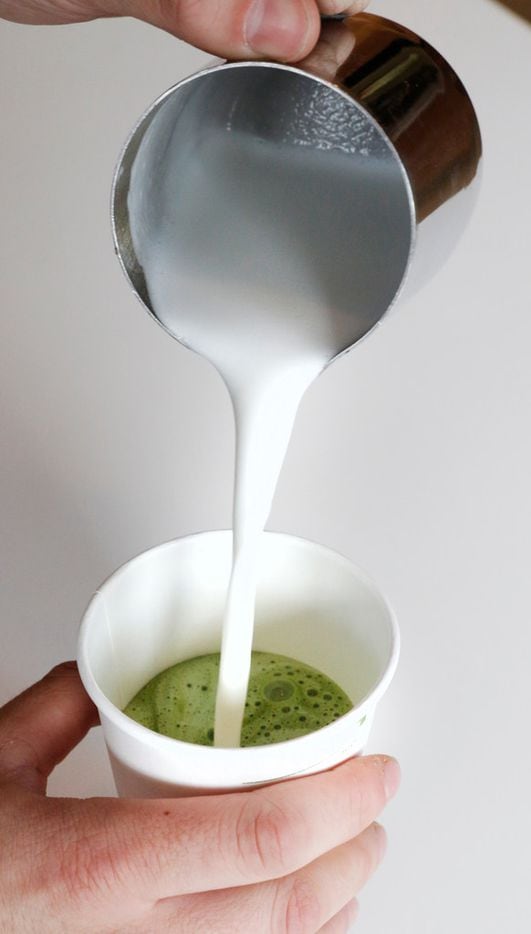 Lead barrister, Ryan Gaston makes a Matcha Latte at Local Press + Brew in Dallas on Monday,...