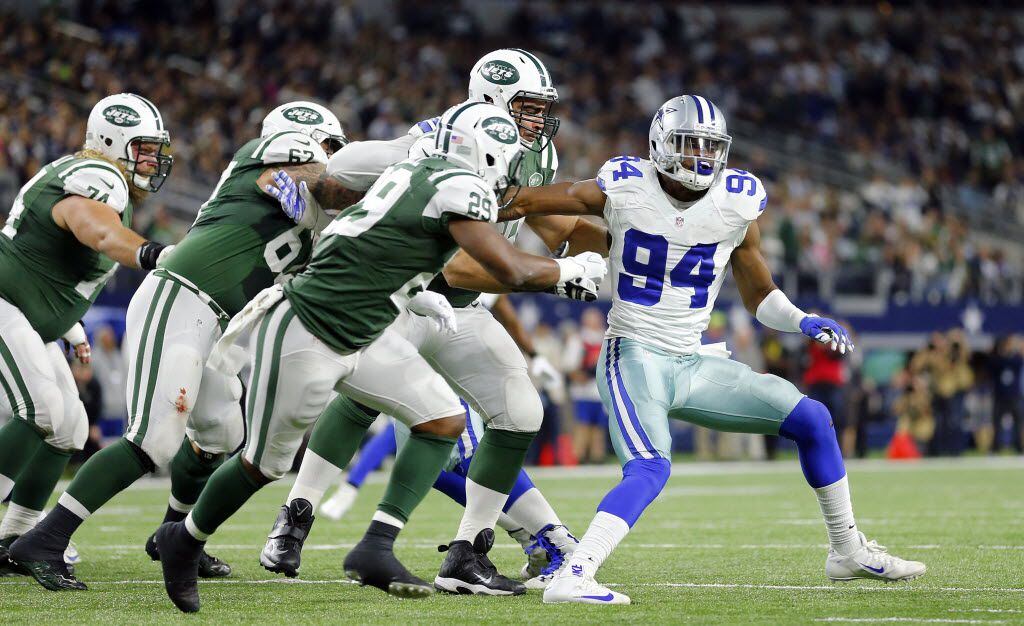 Dallas Cowboys defensive end Randy Gregory (94) is double teamed by the New York Jets...