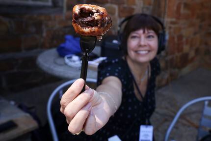 Audio producer Julie Fisk holds up the inside of Deep Fried Rocky Road: ooey gooey.
