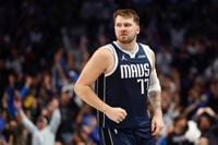 Dallas Mavericks guard Luka Doncic (77) reacts after making a three-pointer during the...