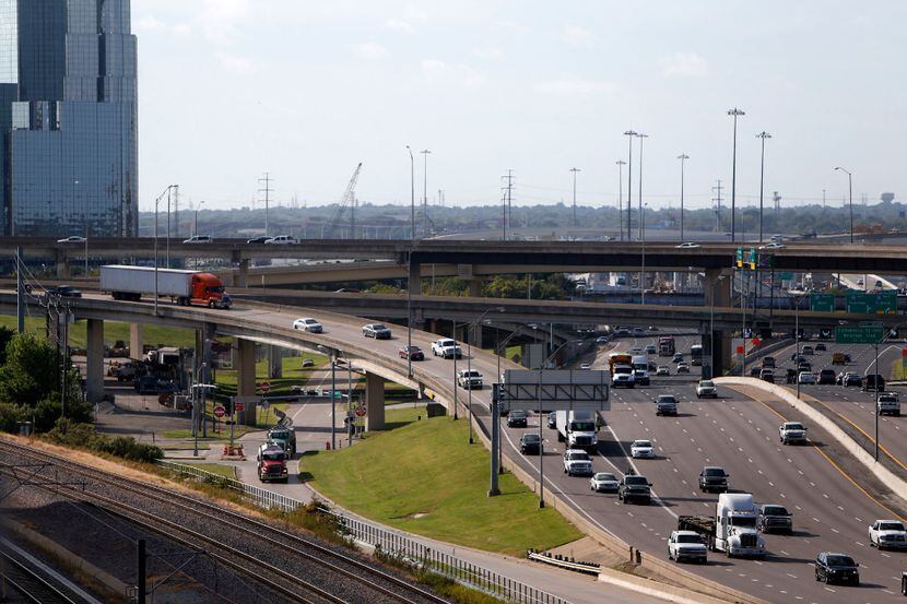 Traffic exits Woodall Rodgers Freeway onto northbound Stemmons (I-35) near downtown Dallas...