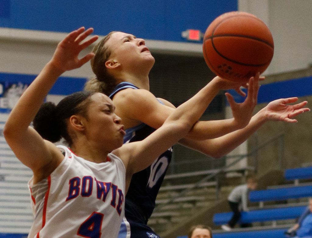 Hurst L.D. Bell guard Jaidyn Carter (10) is fouled by Arlington Bowie guard Alexis Smith (4)...
