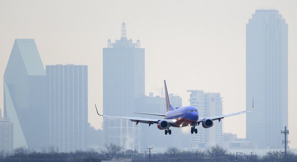 A Southwest Airlines jet plane lines up for a landing at Love Field in Dallas. 