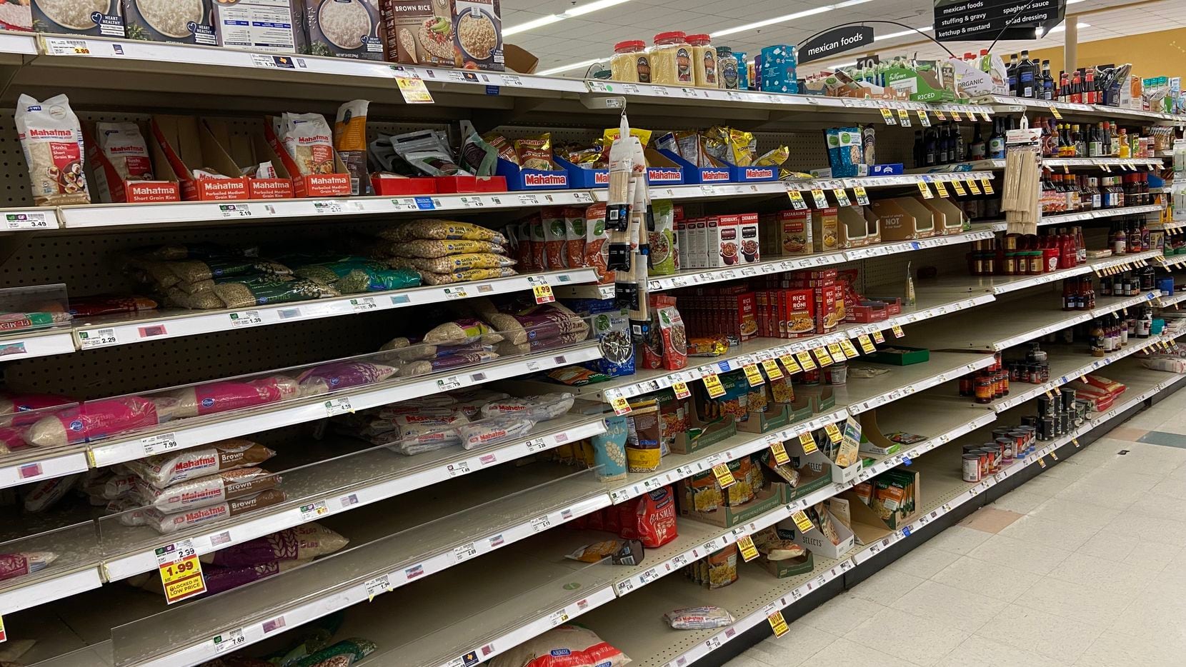 Shoppers this weekend may see some aisles like this one with shelves that aren't fully...