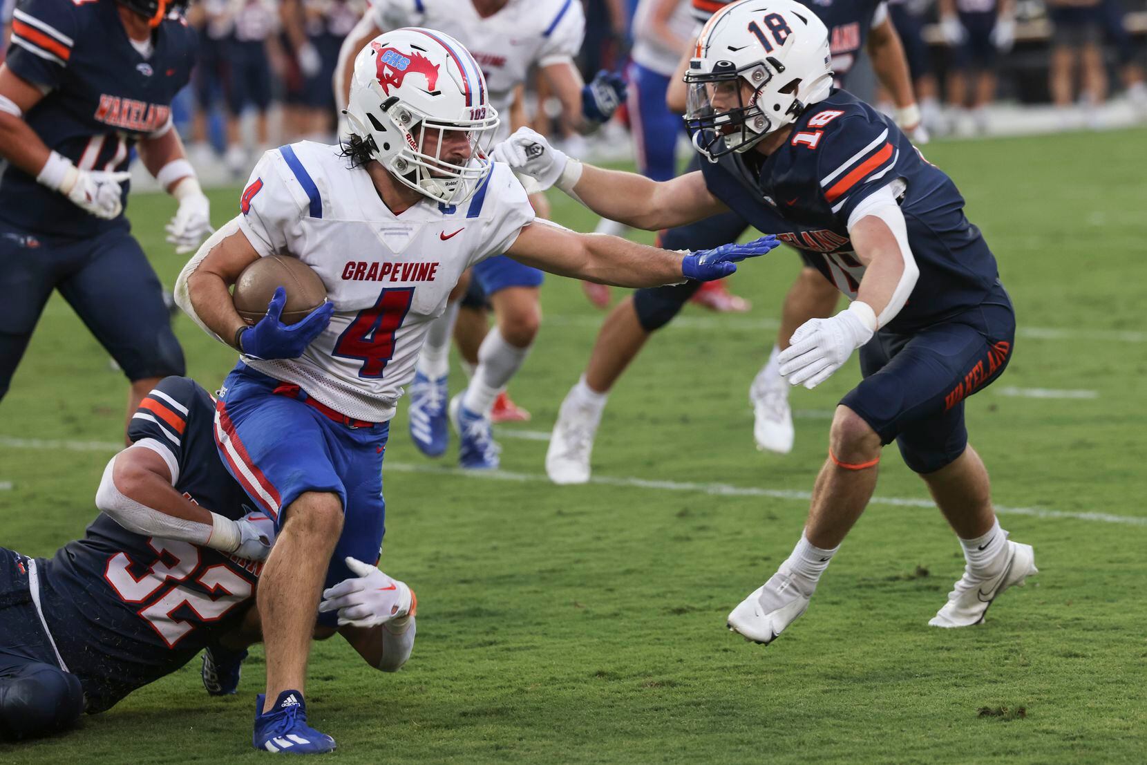 Grapevine High School’s Parker Polk (4) carries the ball up the field as Wakeland High...