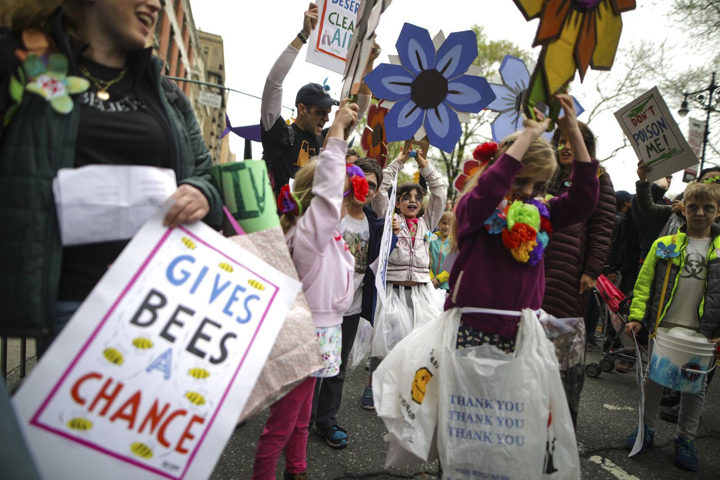 Samantha Norman, 9, center, and other children chant before the March for Science in New...