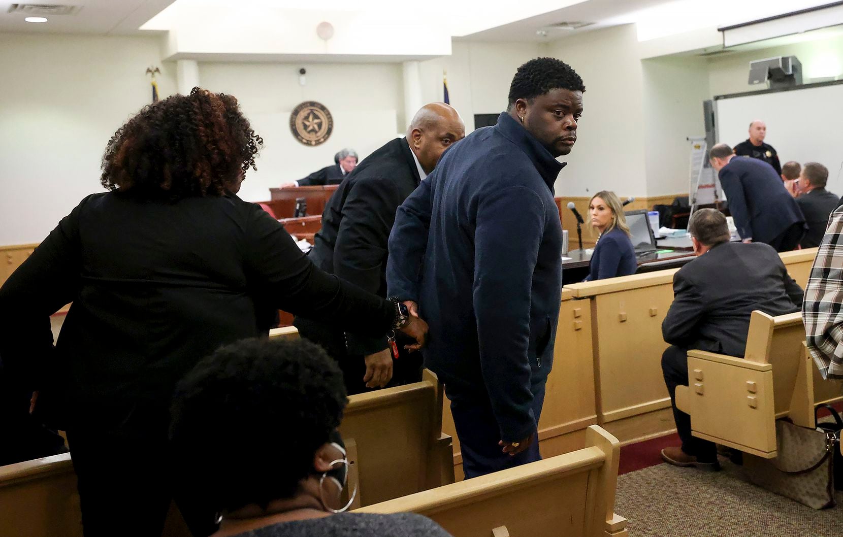 Adarius Carr held his sister Ashley Carr's hand as they left the 396th Circuit Court after...
