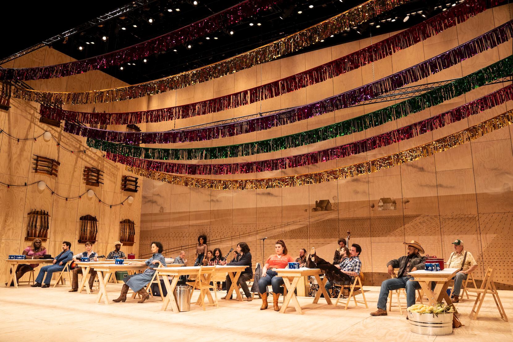 The set of the national touring production of "Oklahoma!" is updated with plywood picnic...