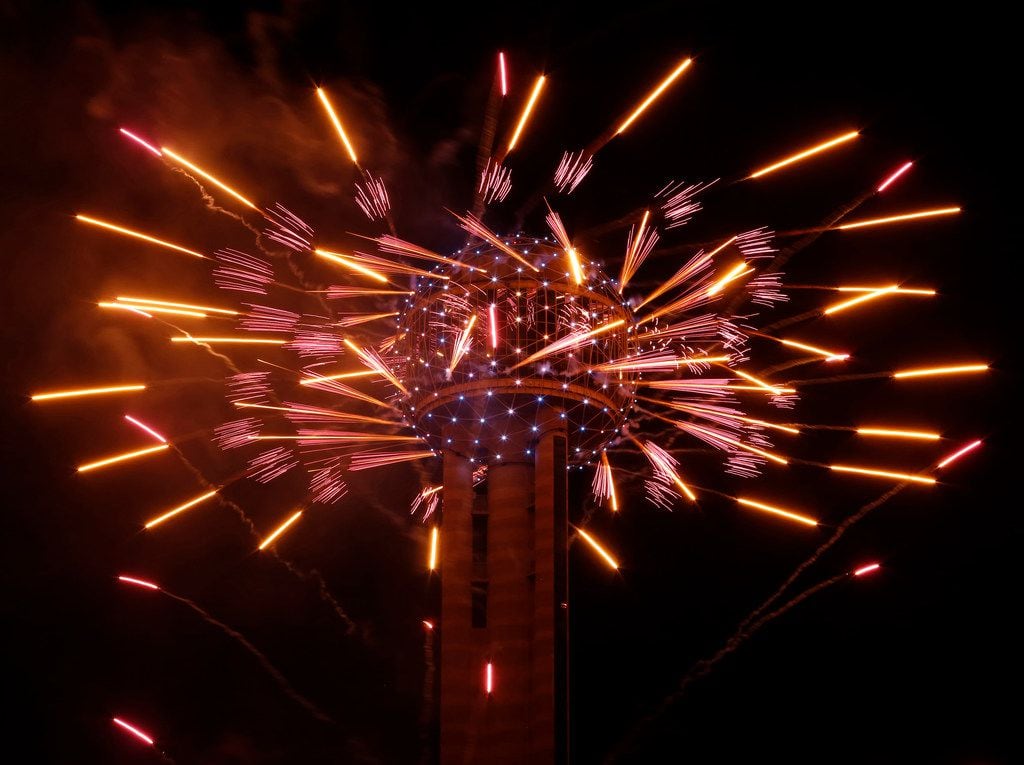 Fireworks fly from Reunion Tower during the New Year's Eve event in Dallas on Dec. 31, 2016.