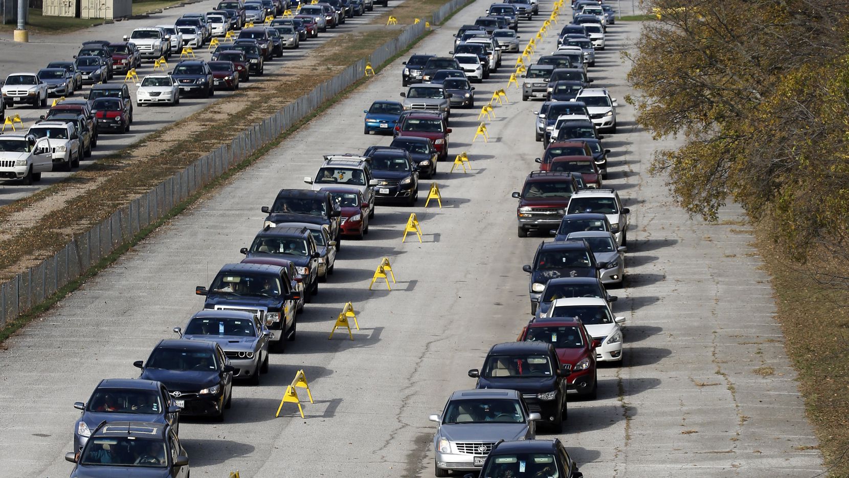 Thousands of vehicles lined up for food at Fair Park in Dallas on Nov. 14. Over half a...